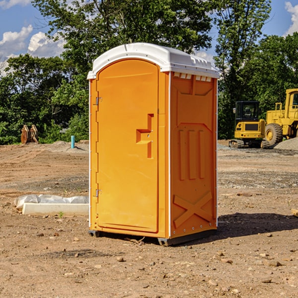 how often are the portable restrooms cleaned and serviced during a rental period in Lewis